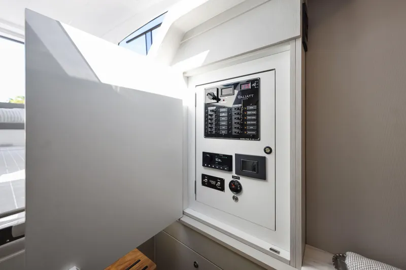 Slide: The Image of Electrical panel inside 2025 Valiatt 380 Bowrider boat, showcasing modern control systems. - 25