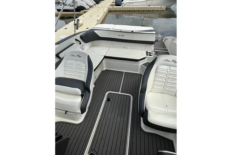 Slide: The Image of 2018 Sea Ray SPX 210 boat interior with sleek seating and modern design. - 3