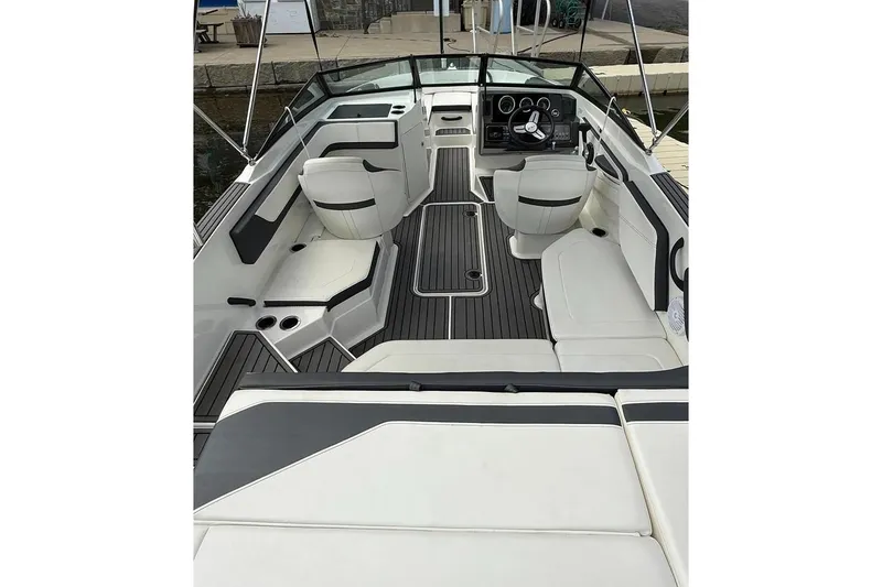 Slide: The Image of 2018 Sea Ray SPX 210 boat interior with sleek seating and modern dashboard. - 8