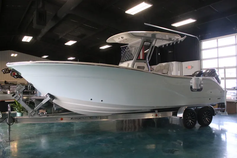 The Image of 2026 Sea Fox 268 Commander boat on trailer in indoor showroom. - 1