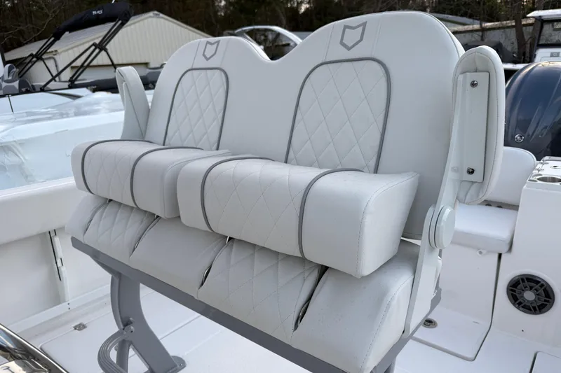 Slide: The Image of Luxury seating on 2026 Sea Fox 268 Commander boat, featuring plush, diamond-stitched upholstery. - 11