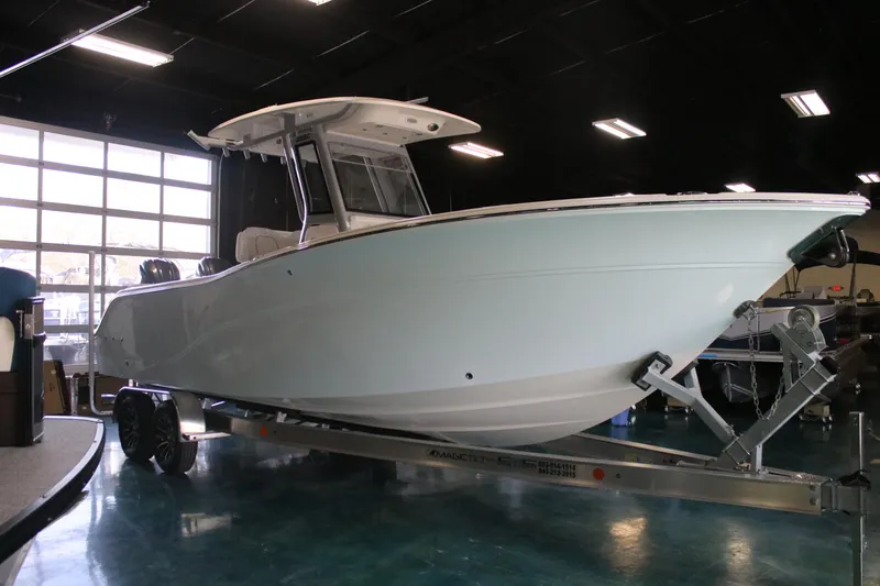 Slide: The Image of 2026 Sea Fox 268 Commander boat on trailer in showroom. - 2