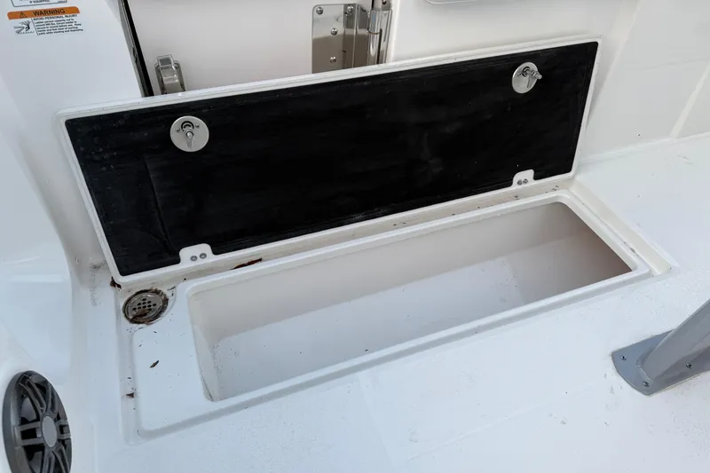 Slide: The Image of Open storage compartment on 2026 Sea Fox 268 Commander boat deck. - 6
