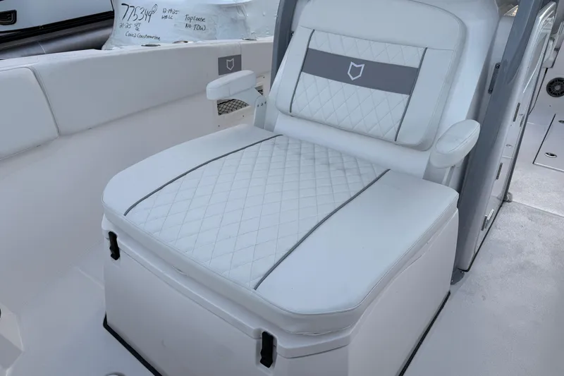 Slide: The Image of 2026 Sea Fox 268 Commander boat seat with quilted white upholstery. - 7