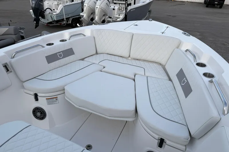 Slide: The Image of 2026 Sea Fox 268 Commander boat with luxurious white seating and cup holders. - 8
