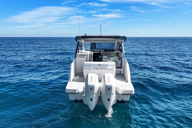 Slide: The Image of 2025 VALIATT YACHTS 380 Bowrider on open sea, showcasing sleek design and powerful engines. - 14