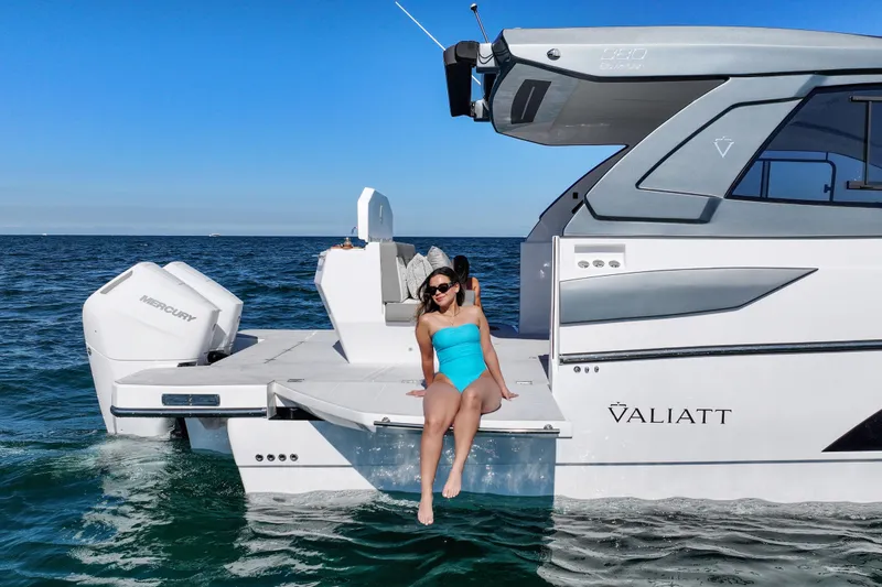 Slide: The Image of Woman relaxing on a 2025 VALIATT YACHTS 380 Bowrider in open water. - 4