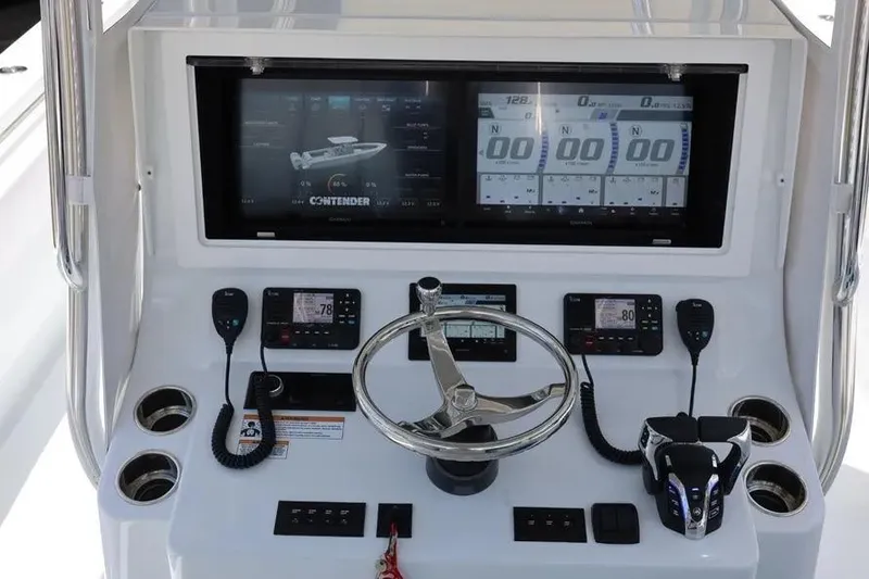 Slide: The Image of 2025 Contender 39 ST boat dashboard with advanced navigation and control systems. - 11
