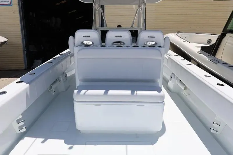 Slide: The Image of 2025 Contender 39 ST boat interior with white seating and console. - 12