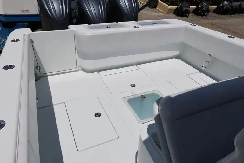 Slide: The Image of 2025 Contender 39 ST boat deck with storage compartments and seating. - 13