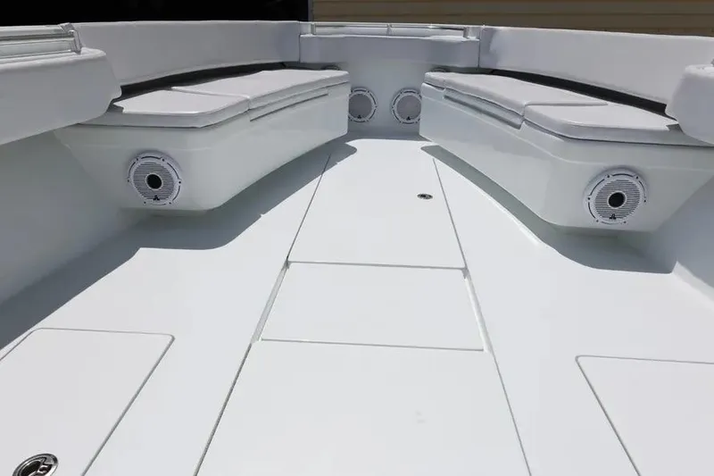 Slide: The Image of 2025 Contender 39 ST boat interior with cushioned seating and built-in speakers. - 7