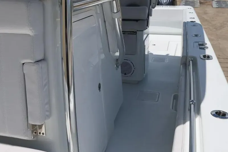 Slide: The Image of 2025 Contender 39 ST boat interior with sleek white seating and stainless steel railings. - 9