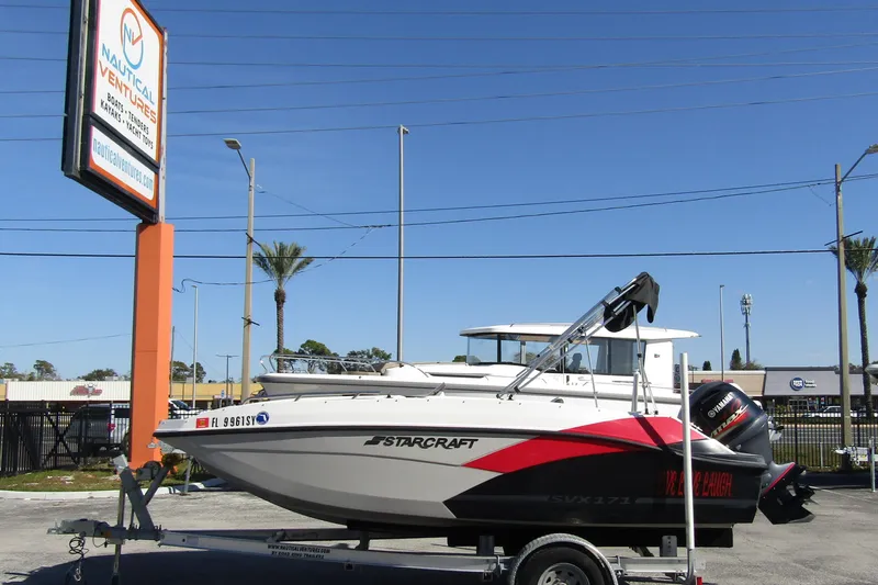 The Image of 2021 Starcraft SVX 171 OB boat on trailer at Nautical Ventures dealership. - 1