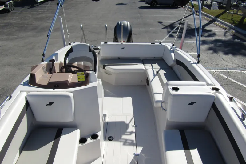 Slide: The Image of 2021 Starcraft SVX 171 OB boat interior with seating and steering console. - 11