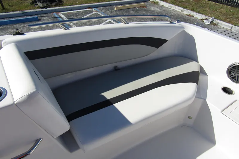 Slide: The Image of 2021 Starcraft SVX 171 OB boat interior seating with sleek design and cup holder. - 12