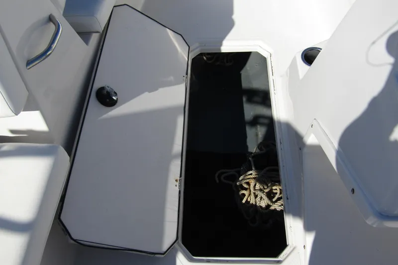 Slide: The Image of Open storage compartment on 2021 Starcraft SVX 171 OB boat with rope inside. - 18