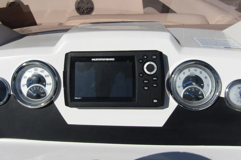 Slide: The Image of Dashboard of 2021 Starcraft SVX 171 OB with gauges and Humminbird Helix 5 display. - 22