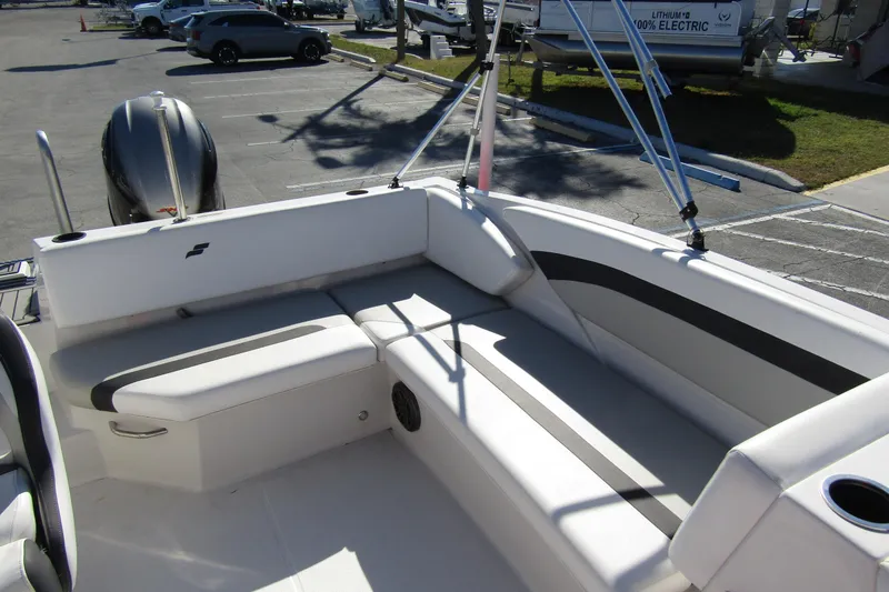 Slide: The Image of 2021 Starcraft SVX 171 OB boat interior with white seating and black accents. - 25