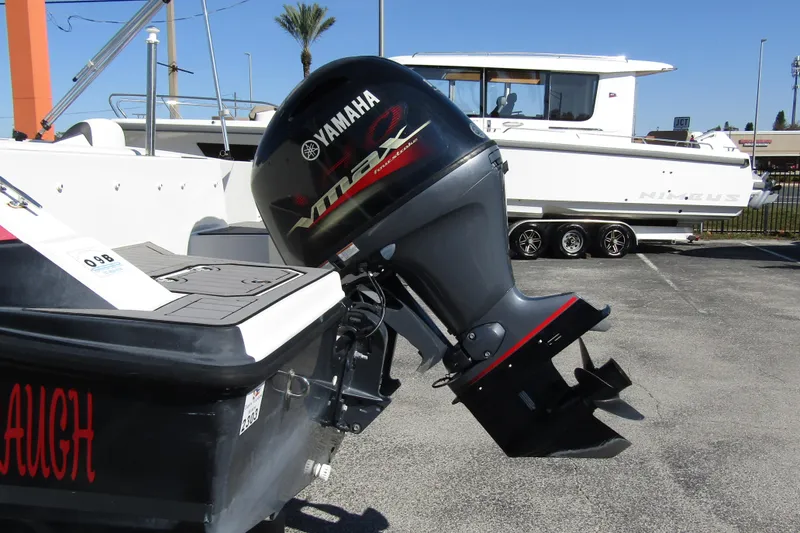 Slide: The Image of 2021 Starcraft SVX 171 OB with Yamaha VMAX outboard motor in a marina setting. - 3