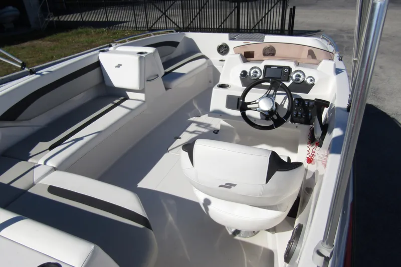 Slide: The Image of 2021 Starcraft SVX 171 OB boat interior with steering wheel and seating. - 31