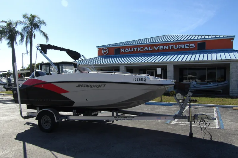 Slide: The Image of 2021 Starcraft SVX 171 OB boat on trailer at Nautical Ventures dealership. - 6