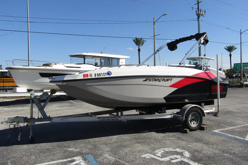 Slide: The Image of 2021 Starcraft SVX 171 OB boat on trailer in parking lot. - 7