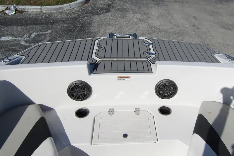 Slide: The Image of 2021 Starcraft SVX 171 OB boat deck with speakers and storage compartments. - 8