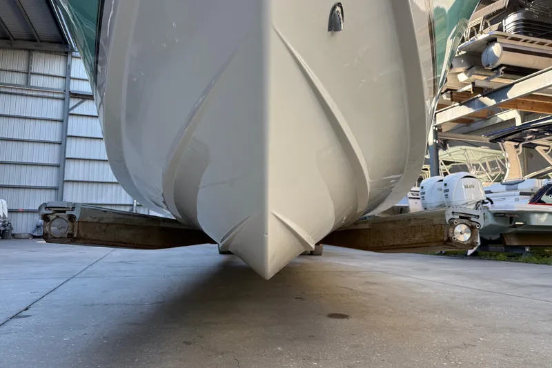 Slide: The Image of 2017 Mako 234 Center Console boat in storage, viewed from the front. - 13