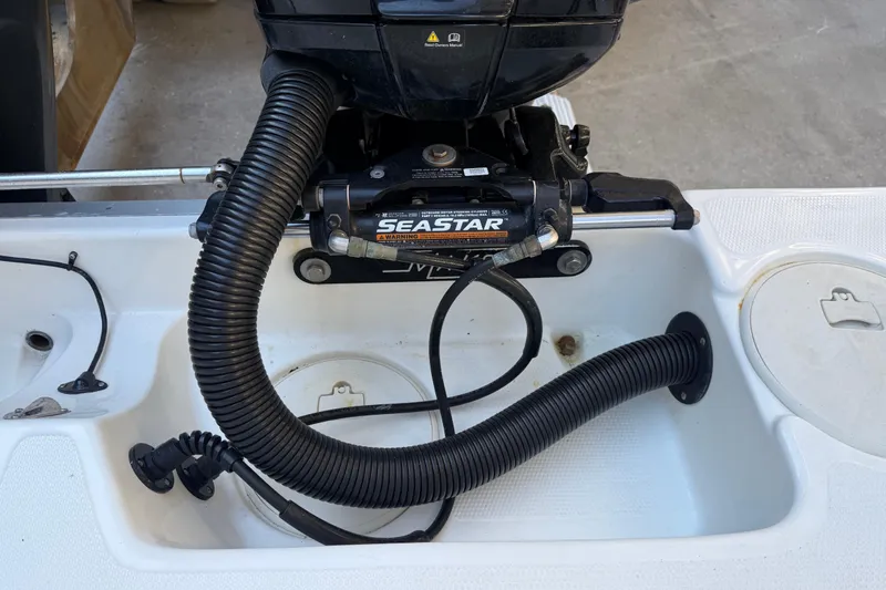 Slide: The Image of 2017 Mako 234 Center Console boat with SeaStar hydraulic steering system. - 20