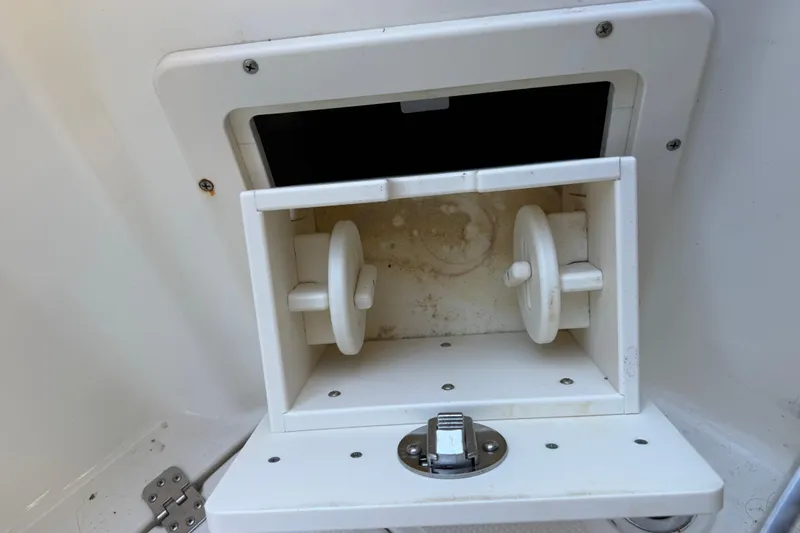 Slide: The Image of Storage compartment on a 2017 Mako 234 Center Console boat. - 28