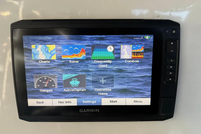 Slide: The Image of Garmin marine display on 2017 Mako 234 Center Console showing navigation and sonar options. - 35