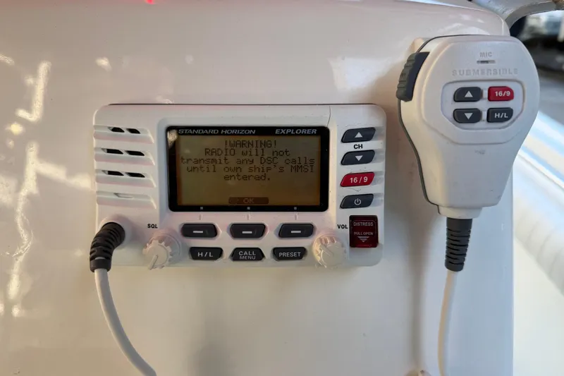 Slide: The Image of VHF radio system on a 2017 Mako 234 Center Console boat, displaying a warning message. - 36
