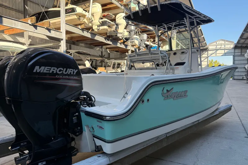 Slide: The Image of 2017 Mako 234 Center Console boat with Mercury engine in storage facility. - 4