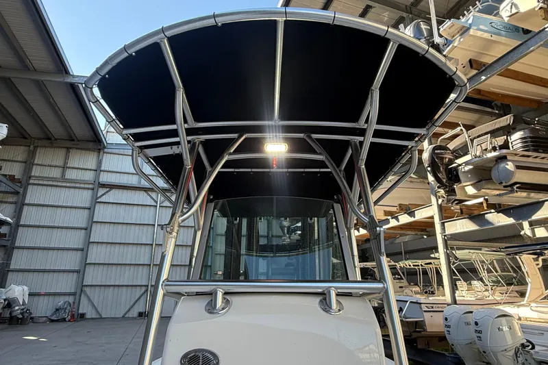 Slide: The Image of 2017 Mako 234 Center Console boat with T-top in storage facility. - 47