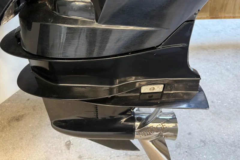 Slide: The Image of Close-up of a 2017 Mako 234 Center Console boat's black outboard motor. - 6