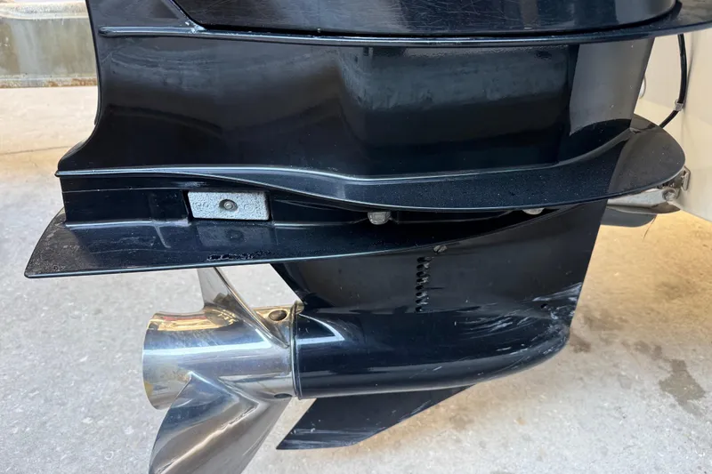 Slide: The Image of Outboard motor of 2017 Mako 234 Center Console boat, showing propeller and lower unit. - 7