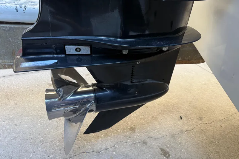 Slide: The Image of Propeller of 2017 Mako 234 Center Console boat on concrete surface. - 9