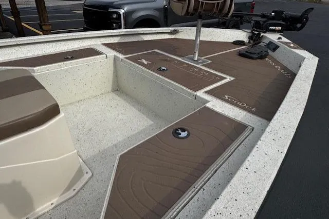 Slide: The Image of 2018 Xpress H20B Bay boat deck with seating and fishing equipment. - 3