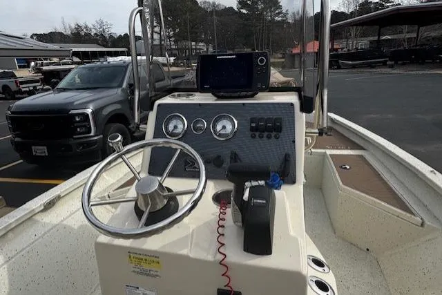 Slide: The Image of 2018 Xpress H20B Bay boat dashboard with steering wheel and navigation equipment. - 6