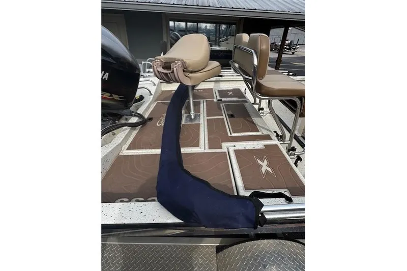 Slide: The Image of 2018 Xpress H20B Bay boat interior with seating and deck details. - 7