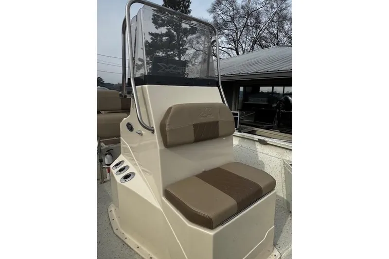 Slide: The Image of 2018 Xpress H20B Bay boat console with seating and windshield. - 9