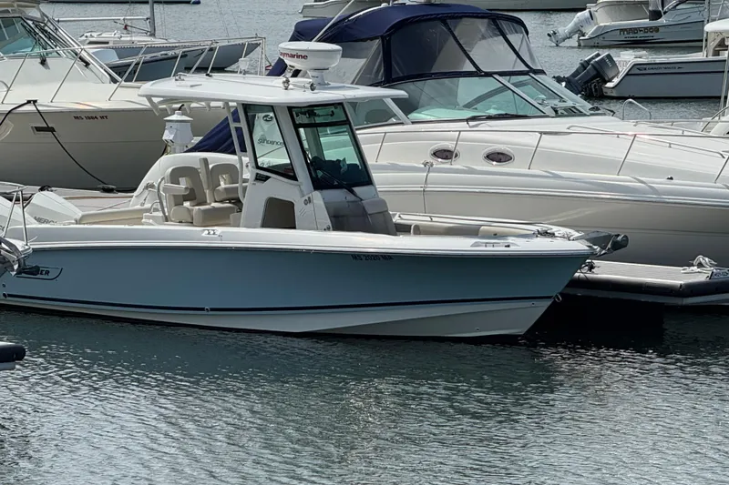 The Image of 2020 Boston Whaler 250 Outrage boat docked in marina. - 0