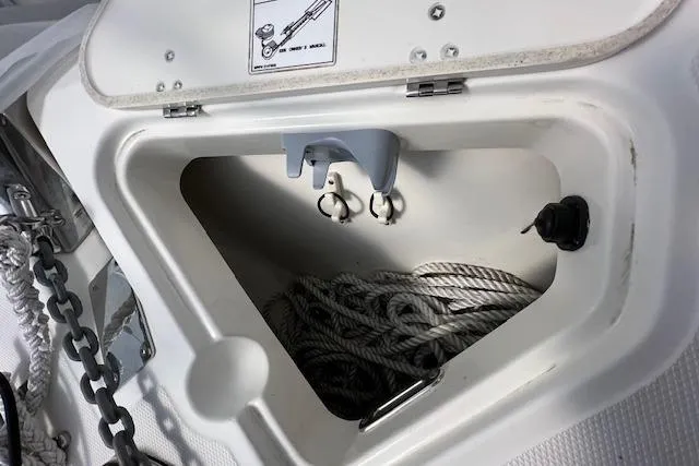 Slide: The Image of 2020 Boston Whaler 250 Outrage anchor locker with rope and chain storage. - 27