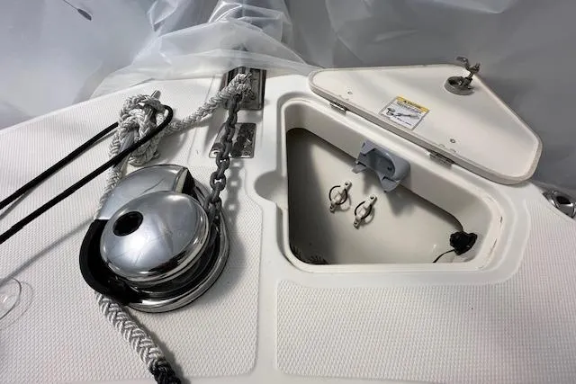 Slide: The Image of Boston Whaler 250 Outrage 2020 anchor locker with winch and rope detail. - 28
