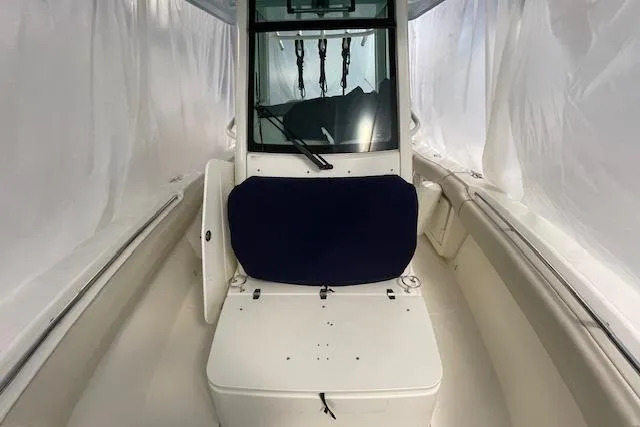 Slide: The Image of 2020 Boston Whaler 250 Outrage boat interior with seating and console. - 38