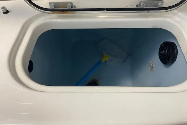 Slide: The Image of Livewell compartment in 2020 Boston Whaler 250 Outrage boat, featuring a cleaning net. - 43