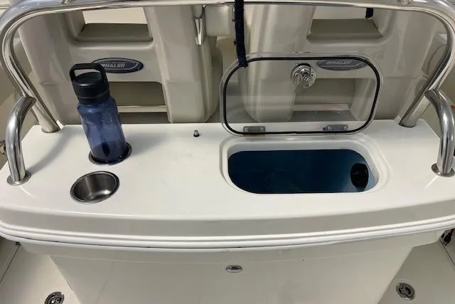 Slide: The Image of 2020 Boston Whaler 250 Outrage boat console with storage and cup holder. - 44