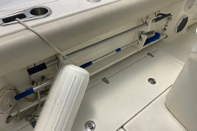 Slide: The Image of 2020 Boston Whaler 250 Outrage interior with storage compartments and marine equipment. - 45