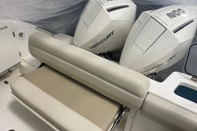 Slide: The Image of 2020 Boston Whaler 250 Outrage with dual Mercury outboard engines and cushioned seating. - 57