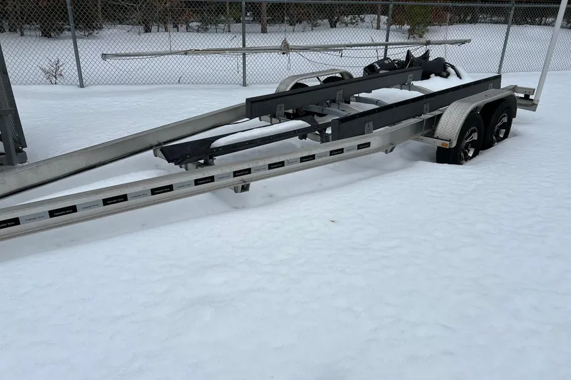 Slide: The Image of Boat trailer in snowy yard, designed for 2020 Boston Whaler 250 Outrage. - 61